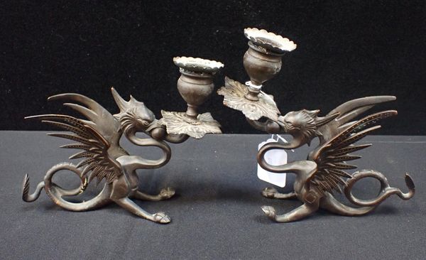 A PAIR OF BRONZE DRAGON CANDLESTICKS