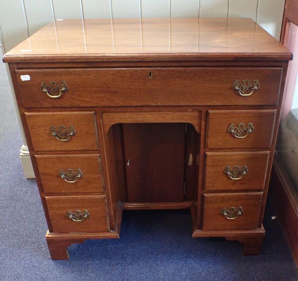 A GEORGE III STYLE MAHOGANY KNEEHOLE DESK