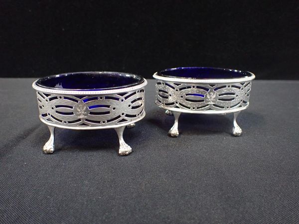 A PAIR OF GEORGE III OVAL SILVER SALTS