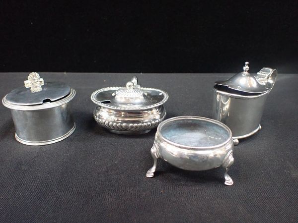 THREE SILVER MUSTARD POTS, AND A SALT