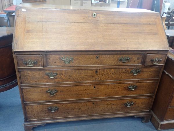 A GEORGE III OAK BUREAU