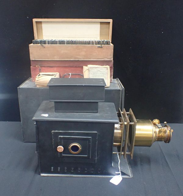 A TINPLATE AND BRASS MAGIC LANTERN, WITH SLIDES