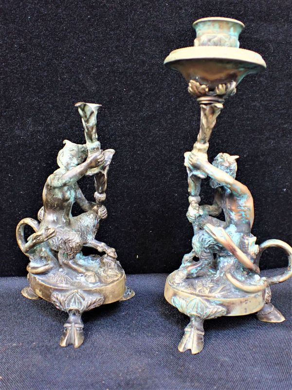 A PAIR OF 19TH CENTURY BRONZE SATYR CANDLESTICKS