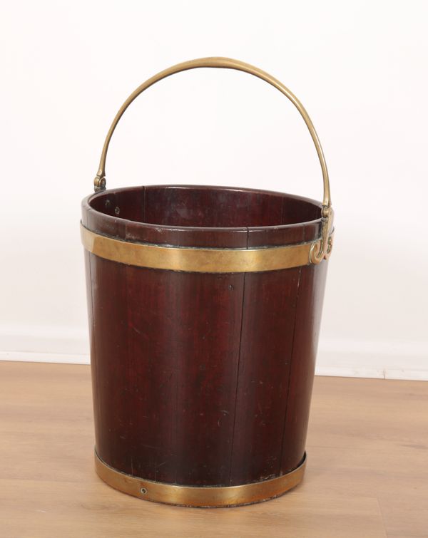 AN IRISH GEORGE III MAHOGANY AND BRASS BOUND PEAT BUCKET