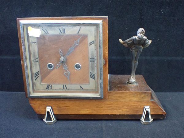 AN ART DECO WALNUT-CASED MANTEL CLOCK