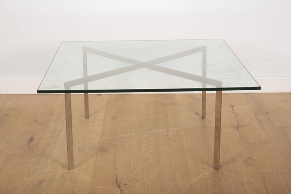 A MODERNIST GLASS TOPPED COFFEE TABLE