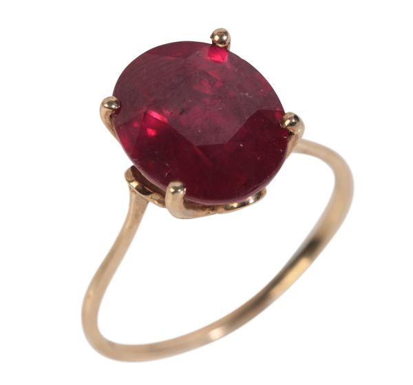 A 9CT GOLD GLASS FILLED RUBY RING