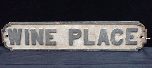 A CAST IRON STREET SIGN; 'WINE PLACE'