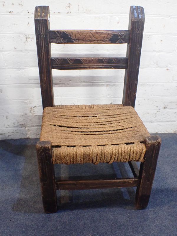 A VERNACULAR 'SUGAN' TYPE STAINED PINE CHAIR