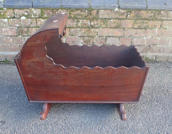 A 19TH CENTURY MAHOGANY ROCKING CRIB