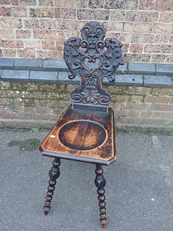 A 19TH CENTURY STAINED PINE HALL CHAIR