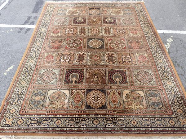 A LARGE RUG, WITH PANELLED 'PERSIAN GARDEN' DESIGN