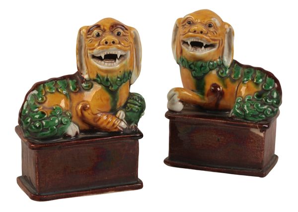 A PAIR OF CHINESE PORCELAIN BUDDHISTIC LIONS