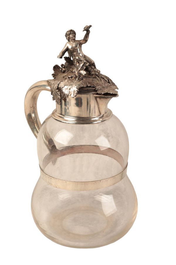 A VICTORIAN SILVER MOUNTED CLARET JUG