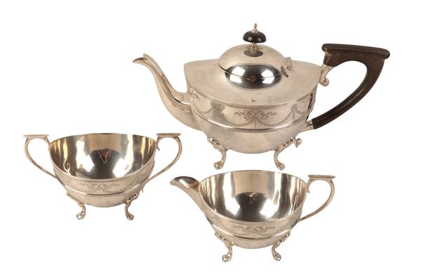 A GEORGE V SILVER THREE PIECE TEA SERVICE