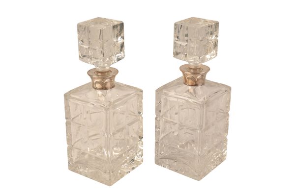 A PAIR OF ELIZABETH II SILVER MOUNTED CUT GLASS DECANTERS AND STOPPERS