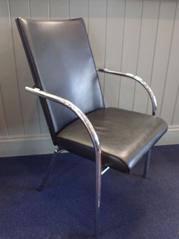 A MODERNIST TUBULAR STEEL ARMCHAIR