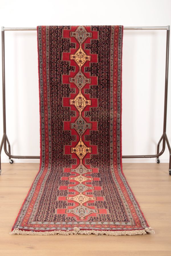 A NORTH WEST PERSIAN SENNEH RUNNER