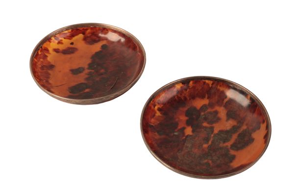 A PAIR OF WHITE METAL MOUNTED TORTOISESHELL DISHES