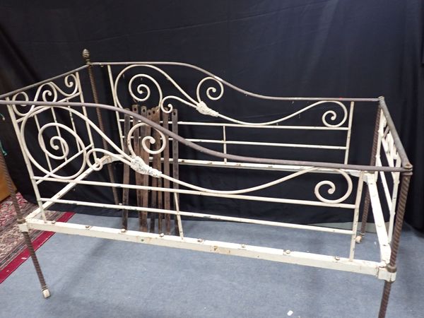 A VICTORIAN CHILD'S  IRON AND BRASS BED