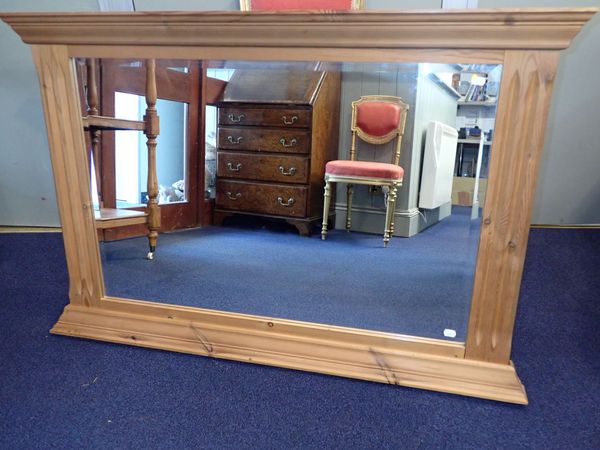 A PINE-FRAMED WALL MIRROR