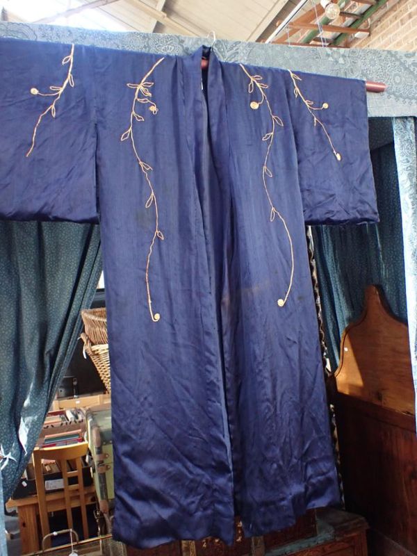 A BLUE SILK KIMONO WITH GOLD COLOURED EMBROIDERY