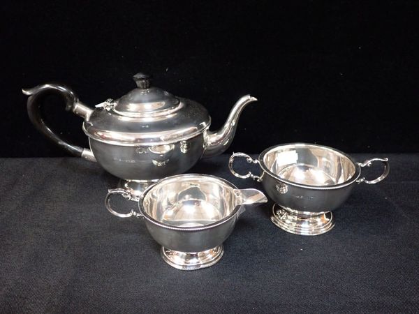 A SILVER THREE-PIECE TEA SET