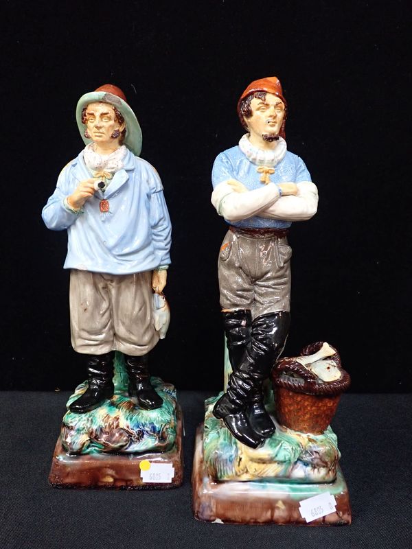 A PAIR OF MAJOLICA TYPE FIGURES OF FISHERMEN