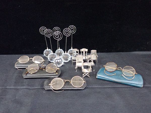 A SET OF SILVER-PLATED PLACE CARD HOLDERS