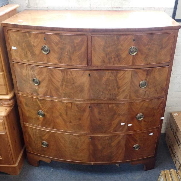 A 19TH CENTURY FIGURED MAHOGANY BOWFRONT CHEST OF DRAWERS