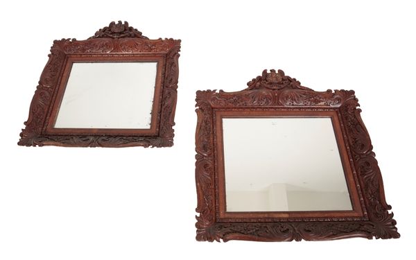 A PAIR OF IRISH CARVED OAK MIRRORS