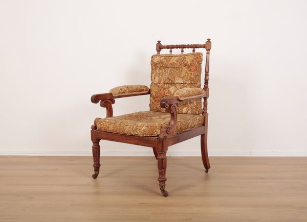 A WILLIAM IV WALNUT ARMCHAIR