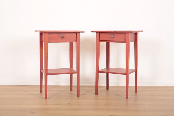 A PAIR OF RED-PAINTED PINE BEDSIDE TABLES