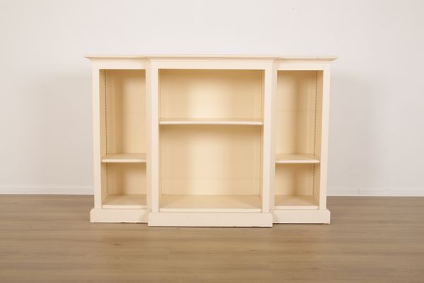 A WHITE-PAINTED BREAKFRONT BOOKCASE