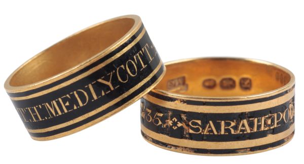 A GEORGE III GOLD AND BLACK ENAMEL MOURNING RING