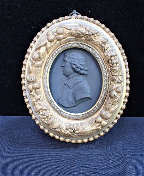 A BLACK BASALTPORTRAIT OVAL OF JOSIAH WEDGWOOD