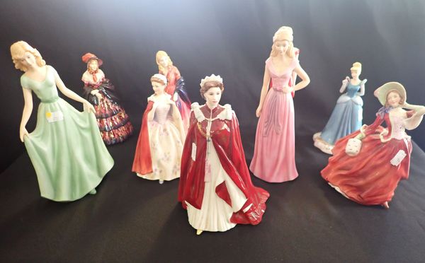 A COLLECTION OF NINE CERAMIC FIGURINES