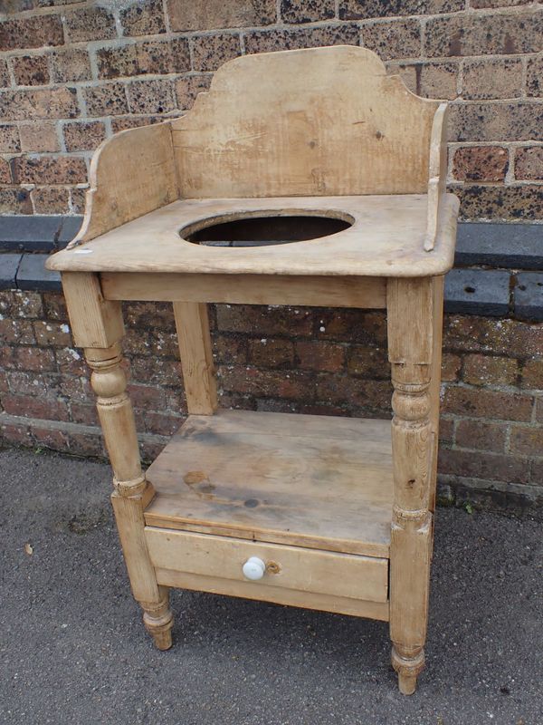 A VICTORIAN STRIPPED PINE WASHSTAND