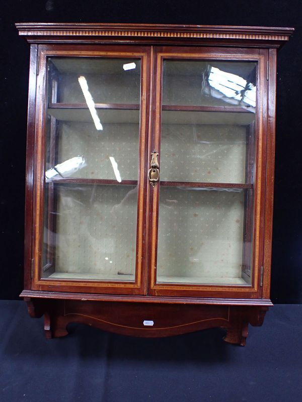 AN EDWARDIAN MAHOGANY GLAZED WALL CABINET