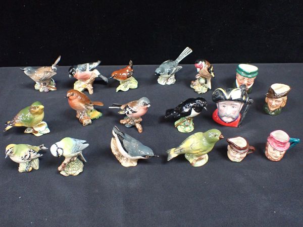 A COLLECTION OF 12 BESWICK BIRD MODELS