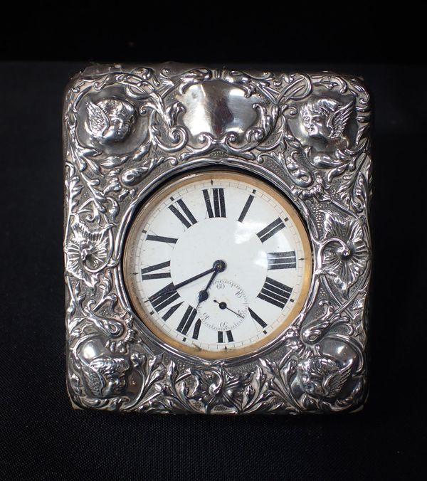 A GOLIATH WATCH, IN A SILVER-FACED FRAME