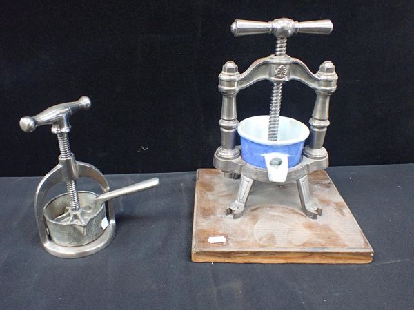 AN IRON KITCHEN PRESS WITH ENAMELLED PAN