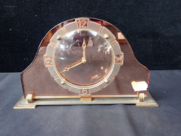 AN ART DECO PEACH GLASS CLOCK