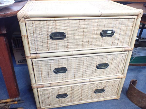 A COLONIAL STYLE RATTAN CHEST OF THREE DRAWERS