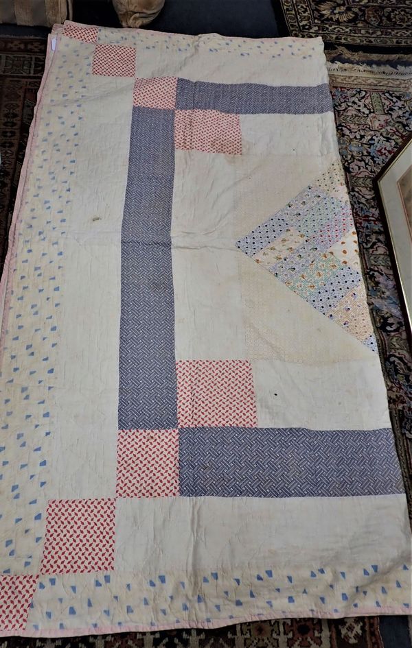 A PATCHWORK QUILT, PATTERNED FABRICS