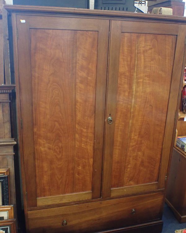 AN EDWARDIAN FIGURED WARDROBE