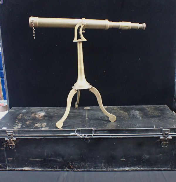 A DECORATIVE BRASS TELESCOPE ON TRIPOD STAND