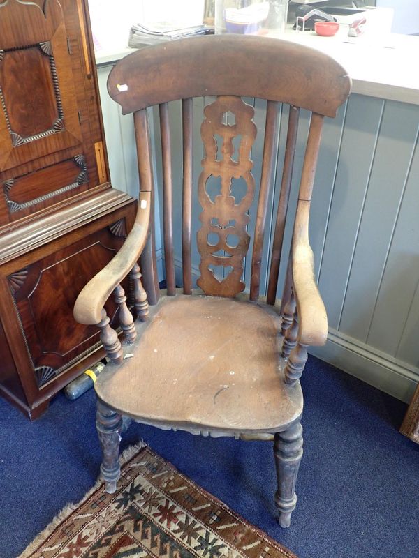 A HEAVILY TURNED 19TH CENTURY LATH-BACK WINDSOR ARMCHAIR