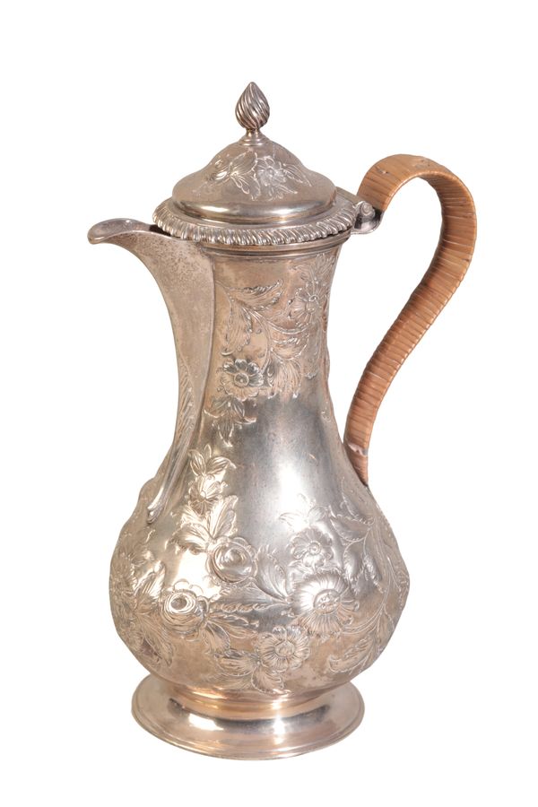 A GEORGE III SILVER HOT WATER JUG