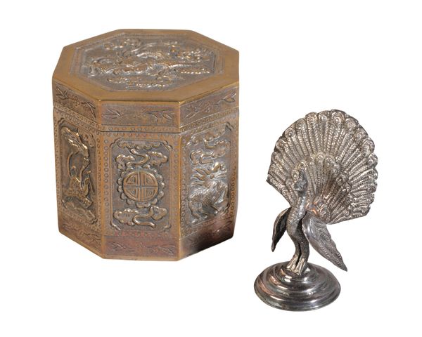 A TIBETAN WHITE METAL OCTAGONAL LIDDED BOX